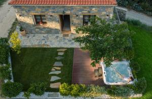 an aerial view of a house with a bath tub in a yard at JIRONI VILLA in Nikiti
