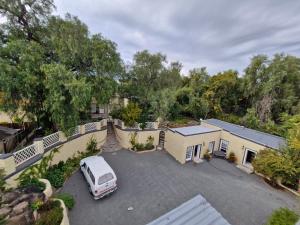 an aerial view of a house with a van parked in a driveway at Coniston Villa in Colesberg