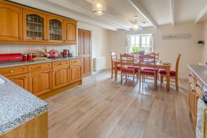 a kitchen with a table and a dining room at 3 Bed in The Lizard oc-treno in Lizard