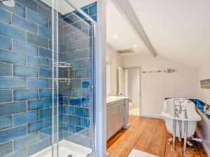 a bathroom with a shower and a tub and a sink at 4 Bed in Snettisham oc-kt124 in Snettisham +26 photos
