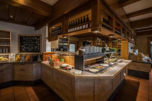 a kitchen with a counter with food on it at AktiVital Hotel in Bad Griesbach