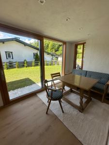 a dining room with a wooden table and chairs at Tiroler Bergchalet bei Kitzbühel in Kirchdorf in Tirol