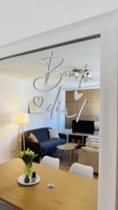 a living room with a table and a blue couch at Calpe Star in Calpe +31 photos