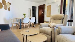 a living room with a couch and chairs and a table at Calpe Star in Calpe