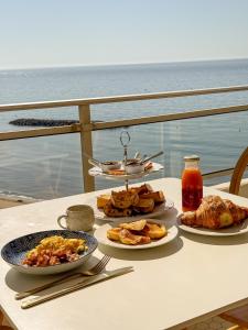a table with three plates of food on it at La Tour Myra in Valras-Plage