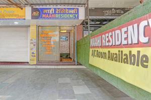 an entrance to a building with a door and signs at Via Maahi Residency in Mumbai +21 photos