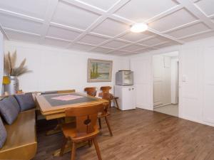 a living room with a table and a couch at Private Rooms near Glarus, Shared Bath in Näfels