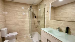 a bathroom with a shower and a toilet and a sink at Alice - Private Pool - 10 Guests - Albufeira in Albufeira