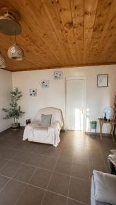 a bedroom with a bed and a wooden ceiling at Olive holiday home in Laganas