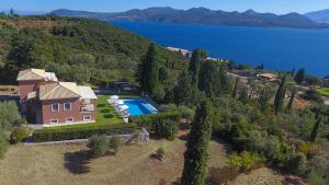 an aerial view of a house with a swimming pool at EOS Luxury Villa in Nydri