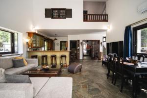 a living room with a couch and a table at Petra Kazarma in Kymi