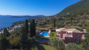 an aerial view of a house with a swimming pool at EOS Luxury Villa in Nydri