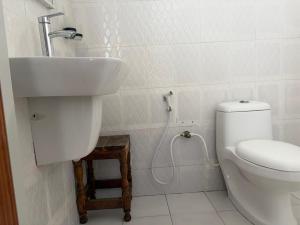 a bathroom with a sink and a toilet at La luna di zanzibar in Kiwengwa +20 photos