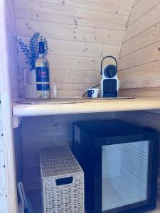 a wooden shelf with a bottle of water on it at Le Tonneau in Carcassonne