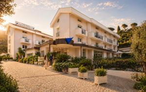 a rendering of the exterior of a hotel at Virgilio Grand Hotel in Sperlonga