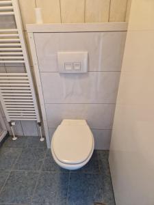 a bathroom with a white toilet in a stall at Watercabin in Ooltgensplaat in Ooltgensplaat +17 photos