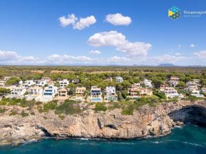an aerial view of a home on a cliff at Villa Sa Troneta in Cala Pi