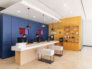 two people sitting at a counter in an office at ibis Ambassador Seoul Insadong-Newly renovated in 2025 in Seoul