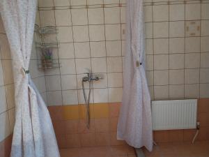 a shower with white curtains in a bathroom at FANTASY GRAND VILLA THASSOS in Astris +114 photos