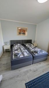 a large bed in a room with at Ferienwohnung in Birkenwerder mit Balkon in Birkenwerder +4 photos