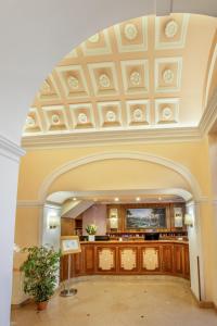 an archway with a coffered ceiling in a lobby at Hotel Della Torre Argentina in Rome