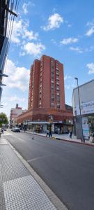 a large red building on the side of a street at Despertar Urbano in Corrientes