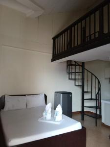 a living room with a couch and a loft at Central View Apartelle in Angeles +13 photos