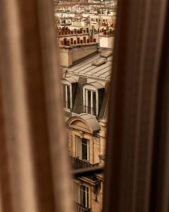 a view from a window of a building at Hôtel BOHEM, Sacré-Cœur in Paris