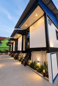 a building with a row of windows on it at ILLUMI Homestay in Dong Hoi