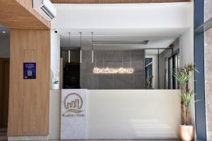a lobby with a reception desk in a building at L'escapade in Sousse +16 photos