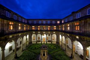 an inside view of a building with a garden at Parador de Santiago - Hostal Reis Catolicos in Santiago de Compostela