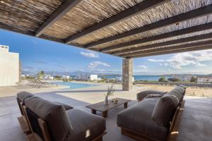 a living room with a couch and a table at Celestial Villas in Santa Maria