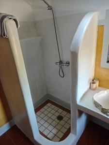 a bathroom with a shower and a sink at Kastri 2 in Kythira