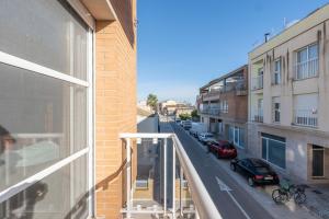 a view of a street from a balcony of a building at ELS BALADRES in Deltebre