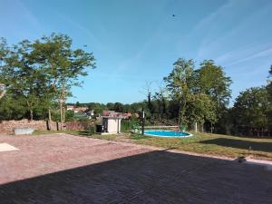 a playground with a swimming pool in a park at B&b A&J in Somogyjád +15 photos