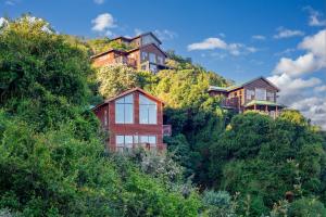 a house on the side of a hill at 7 On Boardwalk in Wilderness