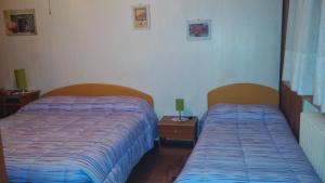 A bed or beds in a room at Le due magnolie