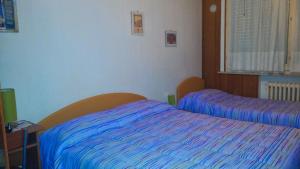 A bed or beds in a room at Le due magnolie