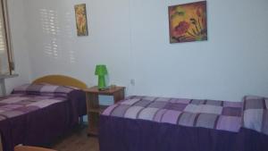 A bed or beds in a room at Le due magnolie