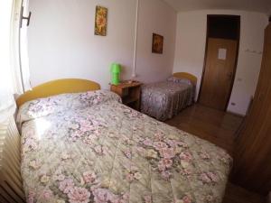 A bed or beds in a room at Le due magnolie