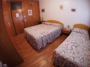 A bed or beds in a room at Le due magnolie