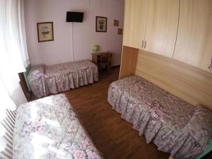 A bed or beds in a room at Le due magnolie