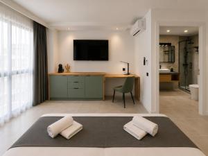 a bedroom with a bed with two pillows at AH Rentals in Vinarós