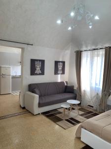 a living room with a couch and a table at Sicilia Ambiente in Montedoro