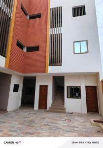 a view of a building with a staircase in front at Résidence saint Daniel in Cotonou