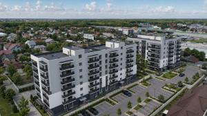 an aerial view of a white apartment building at Spacious 3-Room Apartment - NEW Building in Bucharest