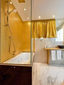 a bathroom with a tub and a shower at Miami Suite in Bellaria-Igea Marina +51 photos