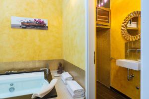 a bathroom with a tub and a sink and a toilet at Villa San Martein in Rovinj +42 photos