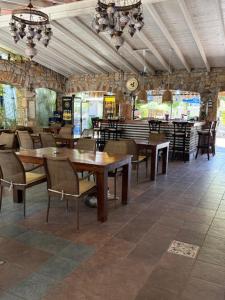 a restaurant with tables and chairs in a room at Sun Blue Apart Hotel in Marmaris