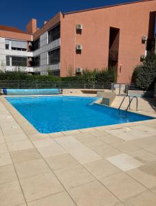 an empty swimming pool in front of a building at Cami del Canigou in Vernet-les-Bains